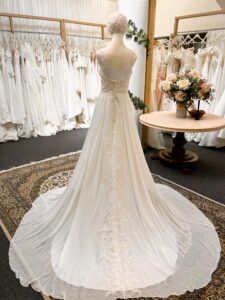 Emerald wedding dress back with button detail and lace train