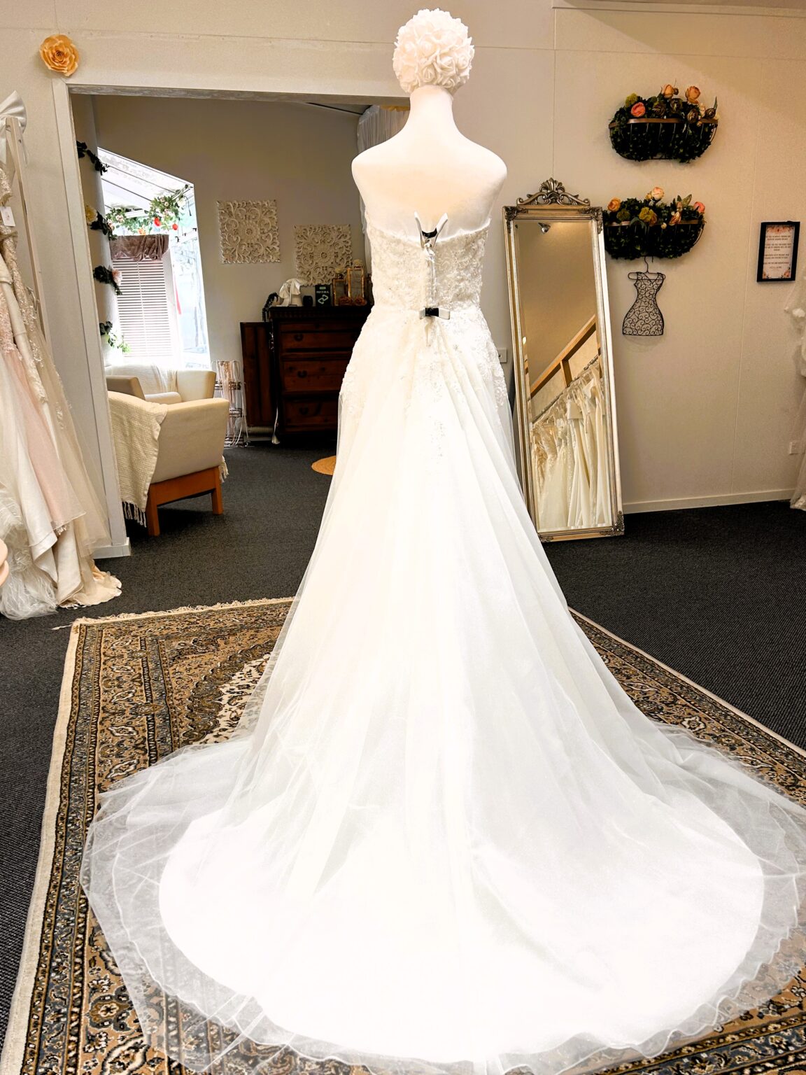 Tania Olsen Lacey wedding dress back view with chapel train
